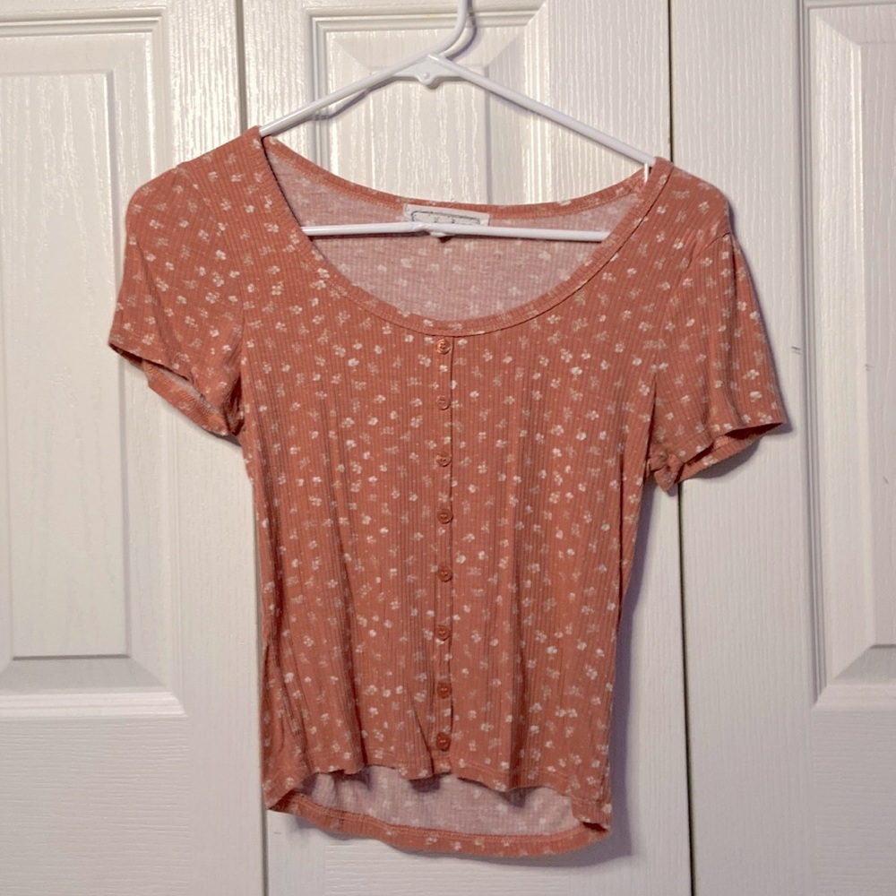 Junior womens salmon floral button up shirt.